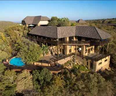 an aerial view of a large house with a pool at Mabalingwe in Bela-Bela