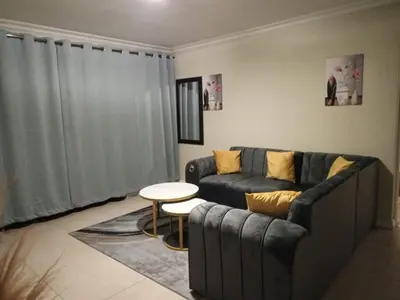 a living room with a couch and a table at Horizon Retreat in Midrand