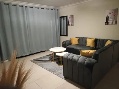 a living room with a couch and a table at Horizon Retreat in Midrand
