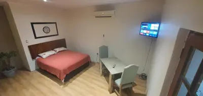 a small bedroom with a bed and a desk at 329 on 30th Avenue Villieria Ashleigh in Pretoria