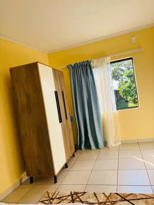 a room with a refrigerator and a window at Cozy Hideout near Kruger in Hectorspruit