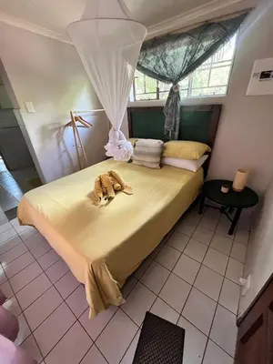 a bedroom with a large bed with at Hello Kruger Skilpad in Marloth Park