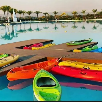 a group of kayaks on a dock in the water at 2 Bedroom The Blyde Crystal Lagoon Luxe in Pretoria