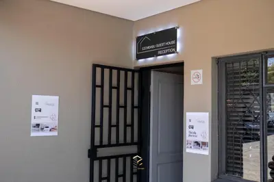 a door to a building with a sign above it at Ezomdabu Guesthouse in Pretoria