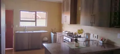 a kitchen with a stove and a counter top at Bouleigh in Kempton Park