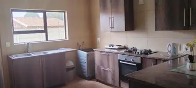 a kitchen with a sink and a counter top at Bouleigh in Kempton Park