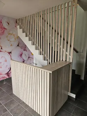 a wooden stair case with aroll at Hippo Zwartkop Suites in Centurion