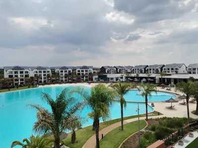 an aerial view of the pool at the resort at The Blyde Taffys Place in Pretoria
