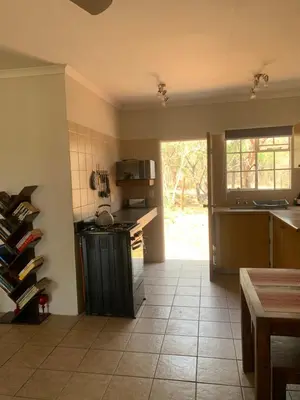 a kitchen with a counter and a stove in it at Green Door Cottage
