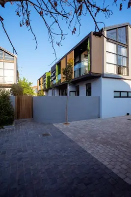 a building with a white wall and a fence at The Pinnacle Polokwane in Polokwane