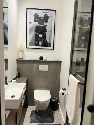 a bathroom with a toilet and a sink at Chic Deluxe Studio, Menlyn Maine, Smart Access in Pretoria