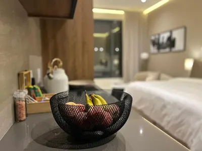 a bowl of bananas on a counter in a hotel room at Chic Deluxe Studio, Menlyn Maine, Smart Access in Pretoria