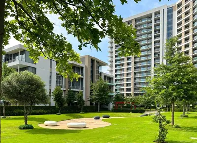 a park with two large buildings in the background at Chic Deluxe Studio, Menlyn Maine, Smart Access in Pretoria