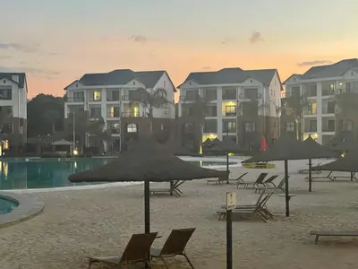 a group of chairs and umbrellas on a beach at The Blyde Pretoria in Pretoria