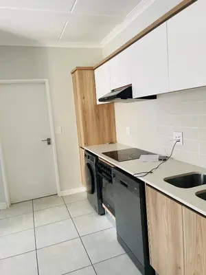 a kitchen with a sink and a dishwasher at The Blyde Crystal Logon in Pretoria