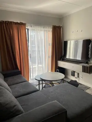 a living room with a couch and a table at The Blyde Crystal Logon in Pretoria