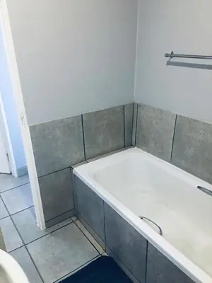 a bathroom with a bath tub in a room at Wotela in Chartwell