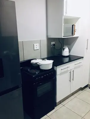 a kitchen with two bowls on top of a stove at Wotela in Chartwell