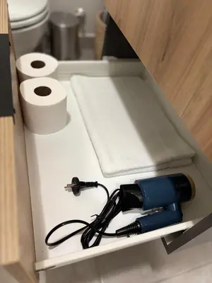 a flashlight in a drawer in a bathroom at Real Kee in Midrand