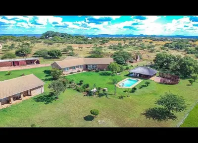 an aerial view of a house with a swimming pool at Elysium Falls House in Roodeplaat