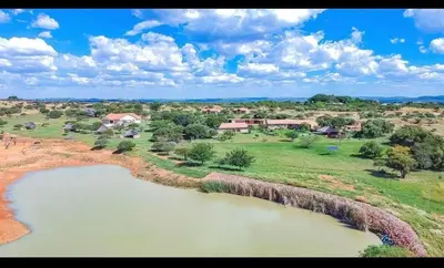 an aerial view of a village with a river at Elysium Falls House in Roodeplaat