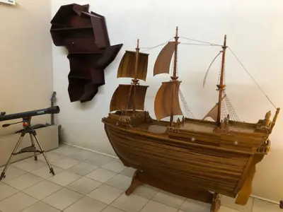 a wooden boat on display in a room with a camera at Horizon small holding in Polokwane