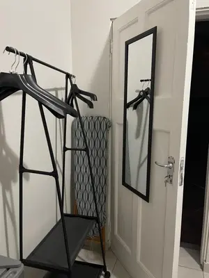 a mirror in a room next to a door at Lani Accommodation in Pretoria