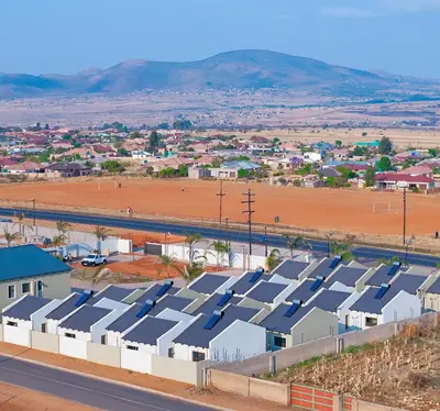 an aerial view of a city with solar panels at Pereng Lodge in Ga-Moloi