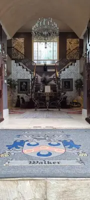 a room with a rug on the floor with a chandelier at The 506 Hotel in Midrand