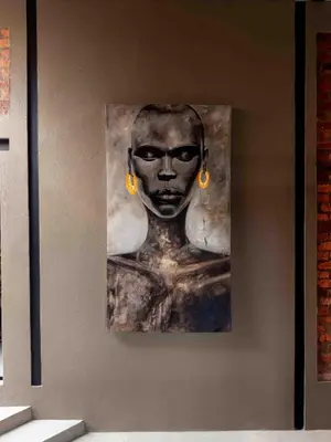a painting of a man with earrings on a wall at vanDijksRus Farm in The Waterberg Biosphere