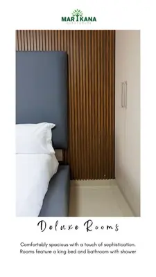 a poster of a bedroom with a bed and a cabinet at Marikana guest house
