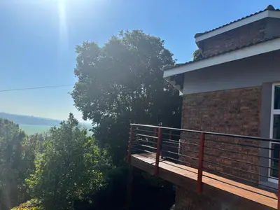 a balcony of a house with a view at The Manzi Villa in Hartbeespoort