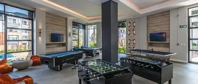 a room with three trampoline tables and two pool tables at The Blyde Crystal Lagoon Pretoria 3Bed in Pretoria