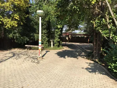 a street light and a bench in a park at JC Studios Ermelo in Ermelo
