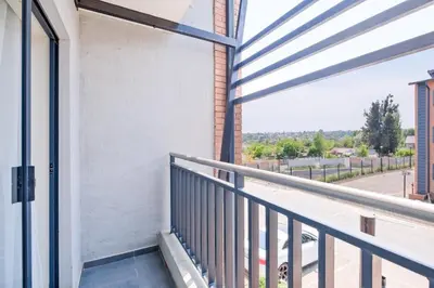 a balcony with a view of a street at Nat's Villa in Midrand