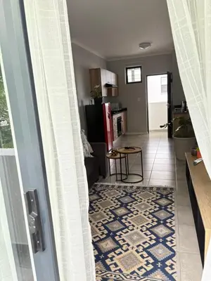 a view of a kitchen and a living room at The four ones in Nelspruit