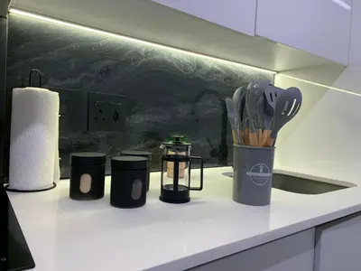 a kitchen counter with utensils on a counter top at Luxury Studio Apartment in Northdene
