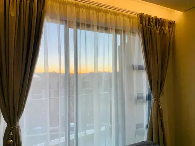 a window with a view of a city at Luxury Studio Apartment in Northdene