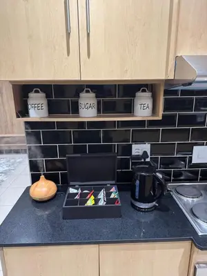 a kitchen counter with a tray of tea on it at Pillowtalk guest house your home away from home in Middelburg
