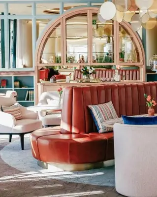 a living room with a red couch and a table at Elite Skyline Suite, Ellipse, Waterfall City in Midrand