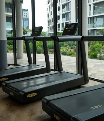 a row of exercise benches in a building at Elite Skyline Suite, Ellipse, Waterfall City in Midrand