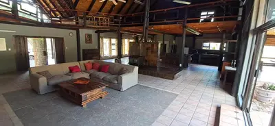 a living room with a couch and a coffee table at Daisy Lodge in Barberton