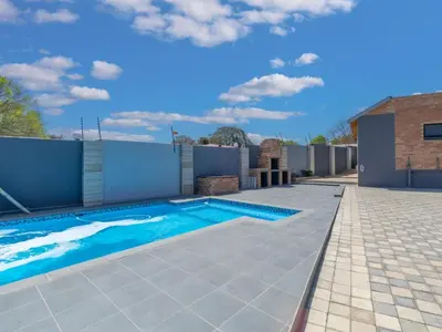 a swimming pool on top of a house at Kuhle Guesthouse in Kempton Park