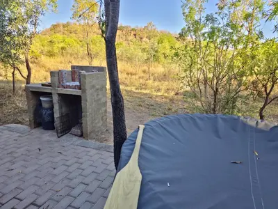 a tent is set up in front of a fireplace at Braai & Bubbles - Modimolle in Modimolle