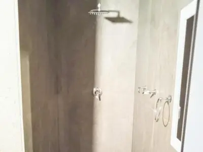 a bathroom with a shower stall with a shower at Waterfall Cabana 3 - Beach Island in Graskop