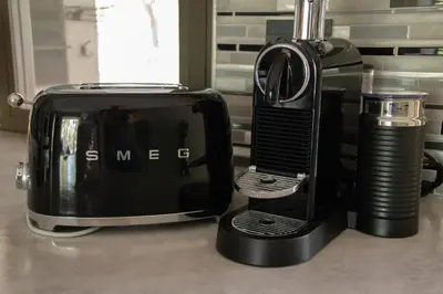 a toaster and coffee maker on a kitchen counter at Ratel Katel in Marloth Park