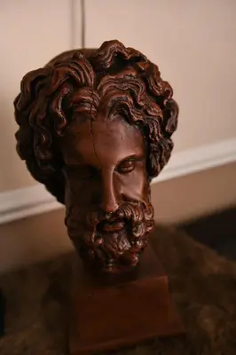 a bronze bust of a man with a beard at Jinaguesthouse and design in Polokwane