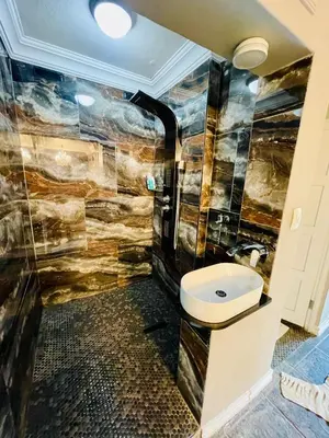 a bathroom with a sink and a toilet in it at Waterkloof Heights Guest House in Pretoria