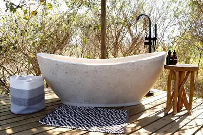 a bath tub sitting on top of a deck at Makonde river lodge in Makonde