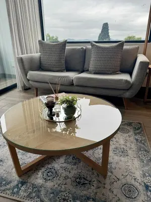 a coffee table in a living room with a couch at 2 beds, 2 bedrooms Family Suites 214 & 214-1 in Pretoria